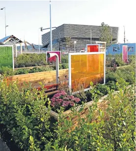  ?? Pictures: Kim Cessford. ?? Left: Students Luis Nicol, Tammy Juckiewicz and Brandyn Stewart view some of the sensory elements in the new V&A community garden, and, above, a view of the garden.