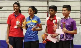  ??  ?? Junior girls’ singles winner Swastika Ghosh ( from left) and runner- up Manushree Patil pose along with boys’ singles champion Manush Shah ( right) and runner- up Anukram Jain in Panchkula on Monday.