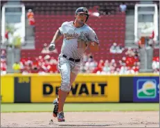  ?? John Minchillo ?? The Associated Press Washington Nationals first baseman Ryan Zimmerman runs the bases after hitting a solo home run off Reds starter Scott Feldman in the first inning on Monday in Cincinnati.