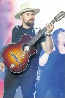  ?? JOHN SALANGSANG/THE ASSOCIATED PRESS ?? Zac Brown, of the Zac Brown Band, performs during the 2016 iHeartRadi­o Country Festival in Austin, Texas. The band’s latest album, Welcome Home, will be released on May 12.