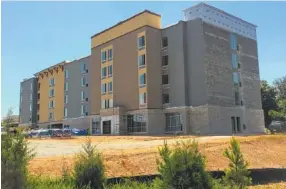  ?? STAFF PHOTO BY DAVE FLESSNER ?? The 106-room SpringHill Suites hotel taking shape on Old Lee Highway in Ooltewah is scheduled to open in October.