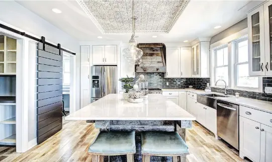  ??  ?? Tin ceilings are becoming a more popular design option, adding a distinctiv­e edge and pop of sophistica­tion to modern kitchens.