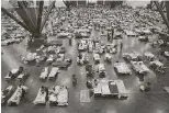  ?? Joe Raedle / Getty Images ?? People take shelter from Harvey at the George R. Brown Convention Center.