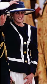  ??  ?? In March, in Birmingham, Meghan stepped out in a navy and white J.Crew coat on similar bold lines to the military look jacket that Diana wore for a remembranc­e service in Liverpool in 1993