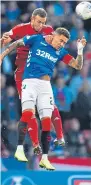  ??  ?? Defenders Andrew Considine and James Tavernier at Hampden