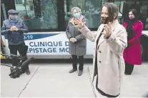  ?? PIERRE OBENDRAUF ?? Dr. Mylène Drouin, Montreal’s public-health director, speaks to reporters with Quebec’s public-health director Dr. Horacio Arruda, left, east-end MNA Chantal Rouleau, centre, and Mayor Valérie Plante on Friday, while getting a tour of a mobile testing clinic for COVID-19.