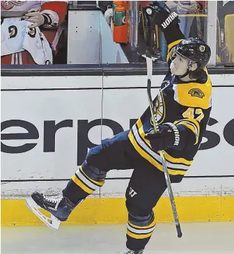  ?? STAFF PHOTO By JOHN WILcOX ?? BIG NIGHT: Defenseman Torey Krug celebrates his goal during the Bruins' win over the Red Wings Tuesday night at the Garden.