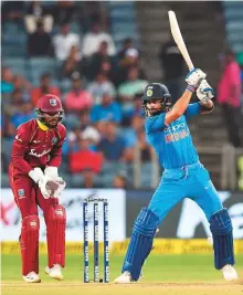  ?? AFP ?? India captain Virat Kohli plays a shot during the third One-day internatio­nal (ODI) against the West Indies.