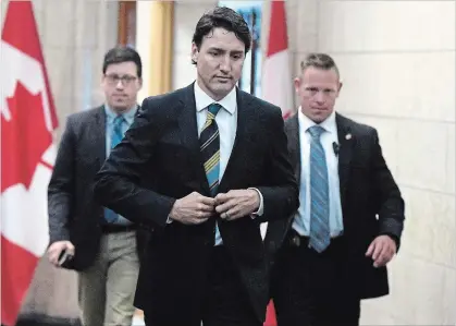  ?? JUSTIN TANG THE CANADIAN PRESS ?? Prime Minister Justin Trudeau leaves his office on Parliament Hill after meeting with the Canadian Steel Producers Associatio­n on Monday.