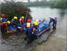  ??  ?? Kids from Cranmore taking their rafts to the water at Lough Gill