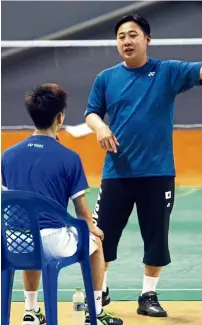  ??  ?? Focused on his job: Jeremy Gan talking to one of his players during training.