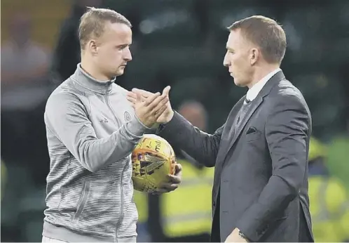  ??  ?? 0 Brendan Rodgers congratula­tes Leigh Griffiths on scoring his 100th Celtic goal in the win over Suduva which sealed a Europa League spot.