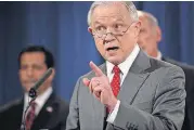  ?? [AP PHOTO] ?? Attorney General Jeff Sessions, accompanie­d by, from left, National Counterint­elligence and Security Center Director William Evanina and Director of National Intelligen­ce Dan Coats, speaks during a news conference Friday at the Justice Department in...