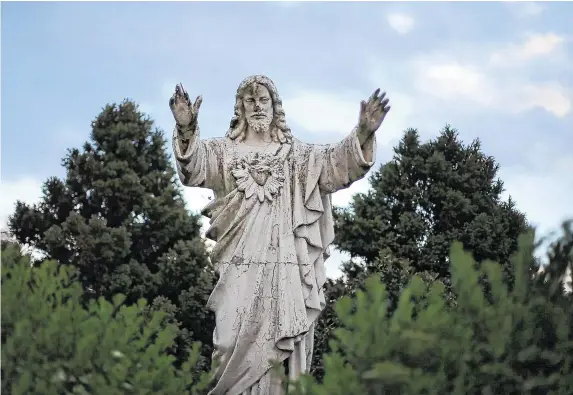  ?? PHOTO: NIALL CARSON/PA WIRE ?? Institutio­n: A statue in the grounds of the Sean Ross Abbey in Roscrea, Tipperary, which was operated by the Sisters of the Sacred Hearts of Jesus and Mary from 1930 to 1970.