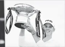  ?? HARRY HOW GETTY IMAGES ?? Brandon Stone of South Africa celebrates victory with the trophy at the Aberdeen Standard Investment­s Scottish Open in on Sunday.