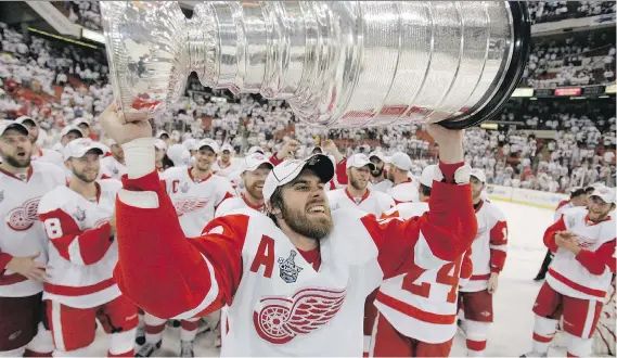  ?? GENE J. PUSKAR/THE ASSOCIATED PRESS ?? Detroit Red Wings alternate captain Henrik Zetterberg hoists the Stanley Cup after the Wings defeated the Pittsburgh Penguins in 2008.