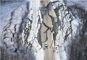  ?? Marc Lester / Anchorage Daily News ?? An aerial photo shows road damage near the town of Wasilla after back-to-back quakes measuring magnitude 7.0 and 5.7 struck the region Friday.