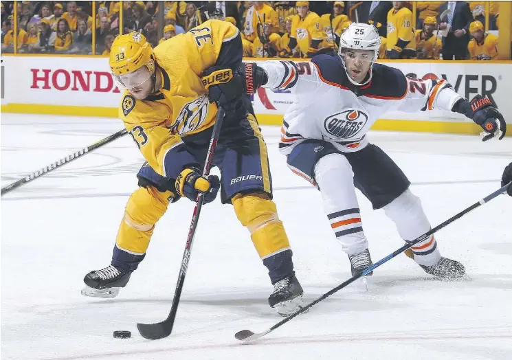  ?? FREDERICK BREEDON/GETTY IMAGES ?? Edmonton defenceman Darnell Nurse, right, has evolved into a front-line player in just his third season with the team.
