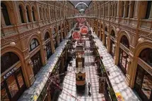  ?? Alexander Zemlianich­enko / Associated Press ?? Few visitors pass inside the GUM department store with lots of boutiques closed due to sanctions in Moscow, Russia, June 1, 2022.