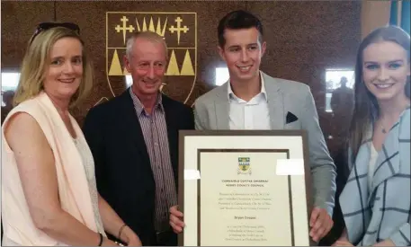  ??  ?? Bryan Cooper with proud family - dad Tom and mother Geraldine and sister Sarah – at the Civic Reception held in his honour in Kerry County Council on Thursday.