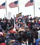  ?? HANNAH GABER/USA TODAY ?? An Oath Keepers banner in a stylized version of an Army Ranger insignia is seen among the flags of thousands of Trump supporters gathered on the National Mall to hear the president speak hours before the Capitol was attacked as Congress met to certify electoral votes.