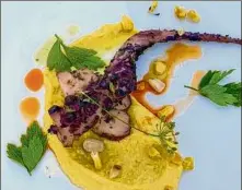  ??  ?? Grilled octopus with corn puree at a farm dinner at Stone Ridge Orchard in Ulster County.