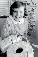  ?? EVENING POST ?? Marie Keith, Miss Decimal Coinage, on July 10, 1967, pictured with her 10th birthday cake, a set of decimal coins and $I note she was given in honour of her role.
