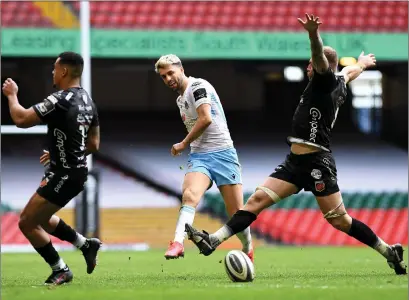  ??  ?? Adam Hastings kicks forward for Glasgow Warriors during their defeat to Dragons in Wales yesterday