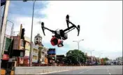  ??  ?? Police use a drone to monitor activity and announce awareness messages after authoritie­s imposed 12 days intensifie­d lockdown due to surge in COVID-19 cases, in Chennai, on Friday