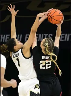  ?? CLIFF GRASSMICK — DAILY CAMERA ?? Colorado’s Tayanna Jones, left, blocks the shot of Stanford’s Cameron Brink on Thursday in Boulder.