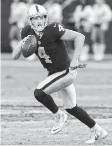  ?? THE ASSOCIATED PRESS ?? Derek Carr was selected 36th overall by the Oakland Raiders in the 2014 NFL draft. In his second season, he has passed for 21 touchdowns while throwing six intercepti­ons and compiling a 99.4 passer rating. The Raiders will try to win today at Tennessee...