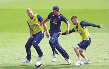  ?? Reuters ?? England’s Alastair Cook (centre), Mark Wood and Ben Stokes (left) play football during a training session in Nottingham yesterday. England lead the series 1-0.