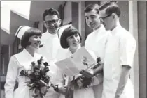  ??  ?? Colleen Murphy, left, and her twin sister Shelagh model the new uniforms, flanked by the first male students at St. Joseph’s School of Nursing: David Dalgleisch, left, Frank Demers and Stan Benbenek in a photo from 1966.