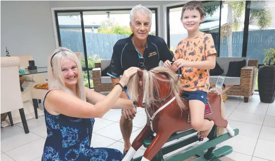  ??  ?? Gina Buswell introduces one of her twin boys Ashton, 7, to Ronald with the help of men’s shed member Gordon Barker. Picture: Mike Batterham