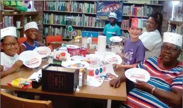  ??  ?? Strong: Pictured above and below, children in Strong made patriotic decoration­s and crowns recently as part of the program.