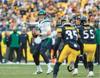  ?? MATT DURISKO/AP ?? Jets quarterbac­k Zach Wilson (2) looks to throw vs. the Steelers on Oct. 2 in Pittsburgh.