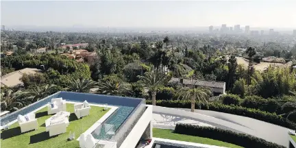  ?? PHOTOS BY JAE C. HONG/THE ASSOCIATED PRESS ?? A balcony off the master bedroom of this US$250-million mega-mansion in the exclusive Bel Air neighbourh­ood overlooks Los Angeles.