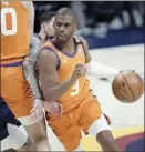  ?? AP photo ?? Chris Paul of the Suns drives to the basket during the first half of Phoenix’s 116-102 win over the Denver Nuggets on Friday.