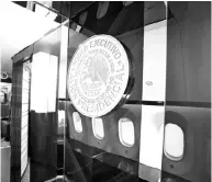  ??  ?? Mexico’s official government seal is seen on a wall of the Mexican Air Force Presidenti­al Boeing 787-8 Dreamliner during a media tour. — Reuters photo