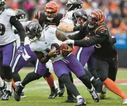  ?? ?? Ravens quarterbac­k Anthony Brown is chased by Bengals defensive end Joseph Ossai during the second half Sunday.