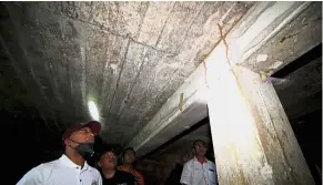  ?? — Bernama ?? What lies beneath: Zambry (left) visiting the undergroun­d bunker found recently near the airport in Ipoh.