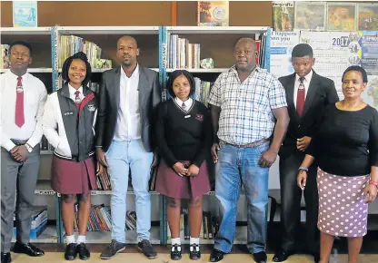  ?? Picture: THANDEKA NTLONTI ?? VERY EXCITED: Uviwe Senior Secondary School has a new library, thanks to the Lindani Mbebeza Education Foundation. Pictured at the opening are, from right, librarian Mavis Yam, Banele Zode, deputy principal Vuyani Mgqolozana, Azola Ngesmani, Lindani...