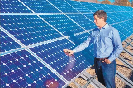  ?? RANDY MONTOYA/ SANDIA LABS ?? Matthew Reno, a Sandia National Laboratori­es engineer, helped develop new software that can perform quasi-static time series analysis to show how rooftop solar panels interact with the electrical grid throughout the year.