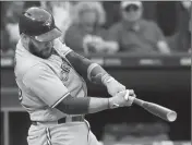  ?? ASSOCIATED PRESS ?? IN THIS JULY 28, 2018, file photo, Toronto Blue Jays’ Russell Martin hits a solo home run against the Chicago White Sox during the third inning of a baseball game in Chicago.