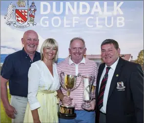  ??  ?? The Gross prize winner in Dundalk’s Intermedia­te Scratch Cup, Paul O’Callaghan, with Ultan and Deborah Herr (sponsors) and Club Captain Gerry Byrne.