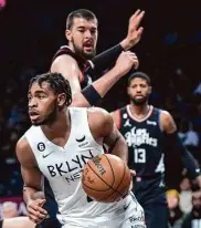  ?? Frank Franklin II/Associated Press ?? The Nets lost despite 47 points from Cam Thomas (front), eluding the Clippers’ Ivica Zubac.