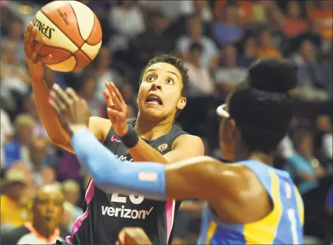  ?? Sean D. Elliot / Associated Press ?? Connecticu­t Sun guard Layshia Clarendon, left, drives to the basket as Chicago Sky guard Diamon DeShields defends in the second half on Aug. 12.