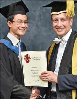  ??  ?? Proud: Getting his degree from vice-chancellor Paul Boyle