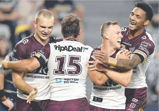  ?? Picture: Getty Images ?? Manly skipper Daly Cherry-Evans (second from right) celebrates after scoring a try against the Cowboys last weekend.