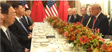  ?? — AFP photo ?? Trump (right) and China’s President Xi Jinping (left, centre) are seen having dinner at the end of the G20 Leaders’ Summit in Buenos Aires, Argentina.